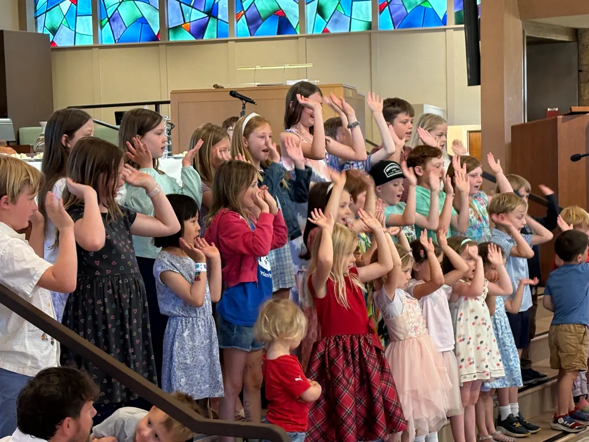 Children singing at the front of the PCLG Sanctuary.