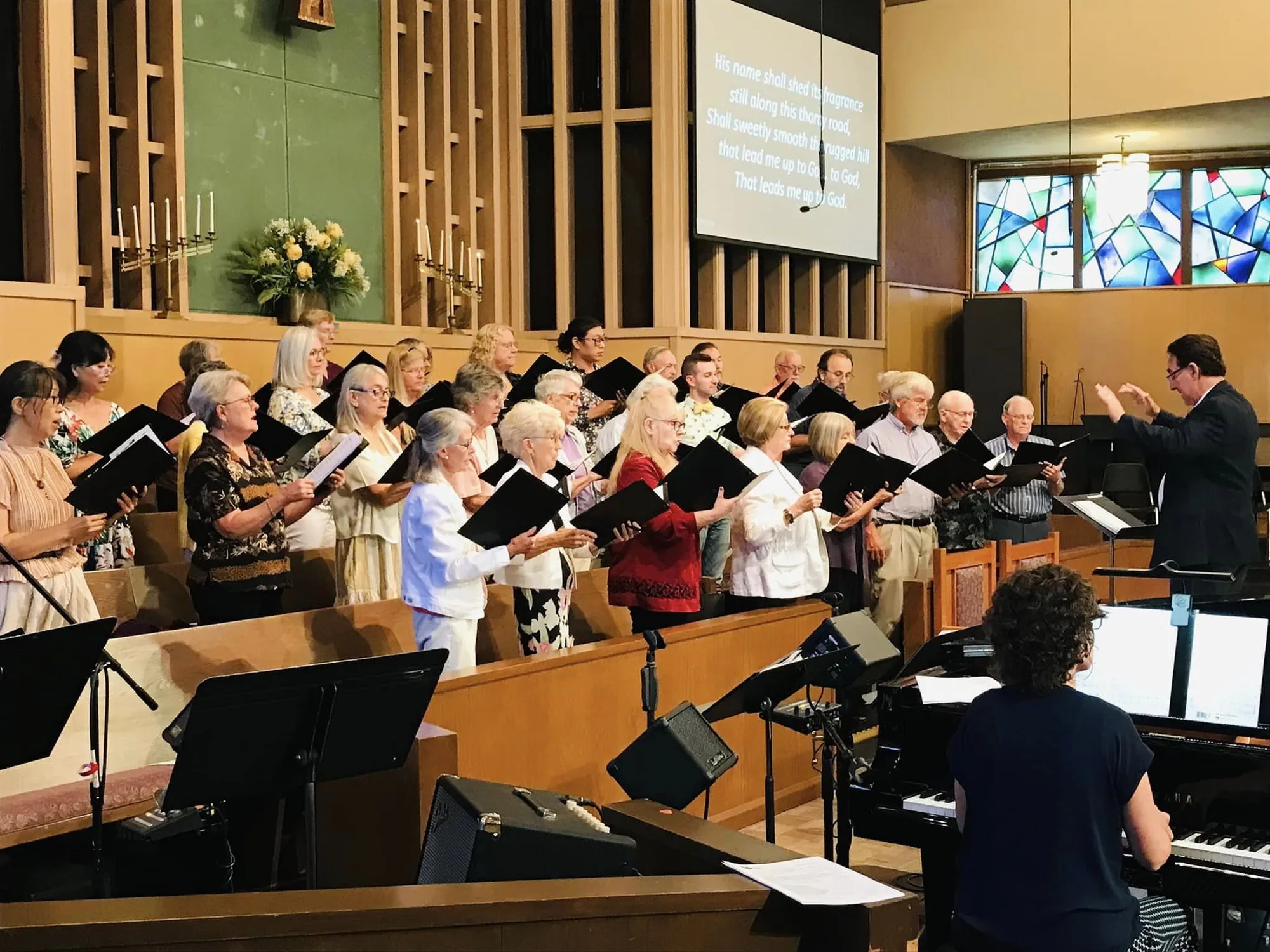 The Chancel Choir singing during Sunday worship.