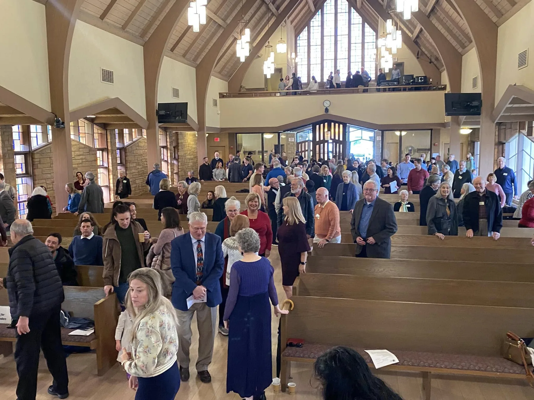 The PCLG congregation standing together in the Sanctuary during Sunday worship.